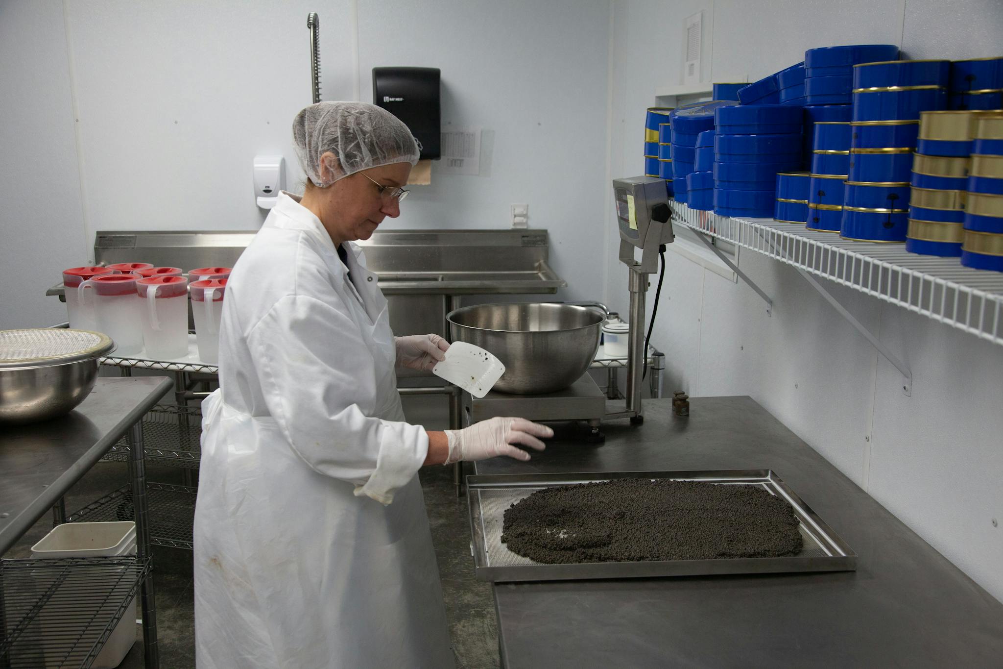 man in white chef suit holding gray